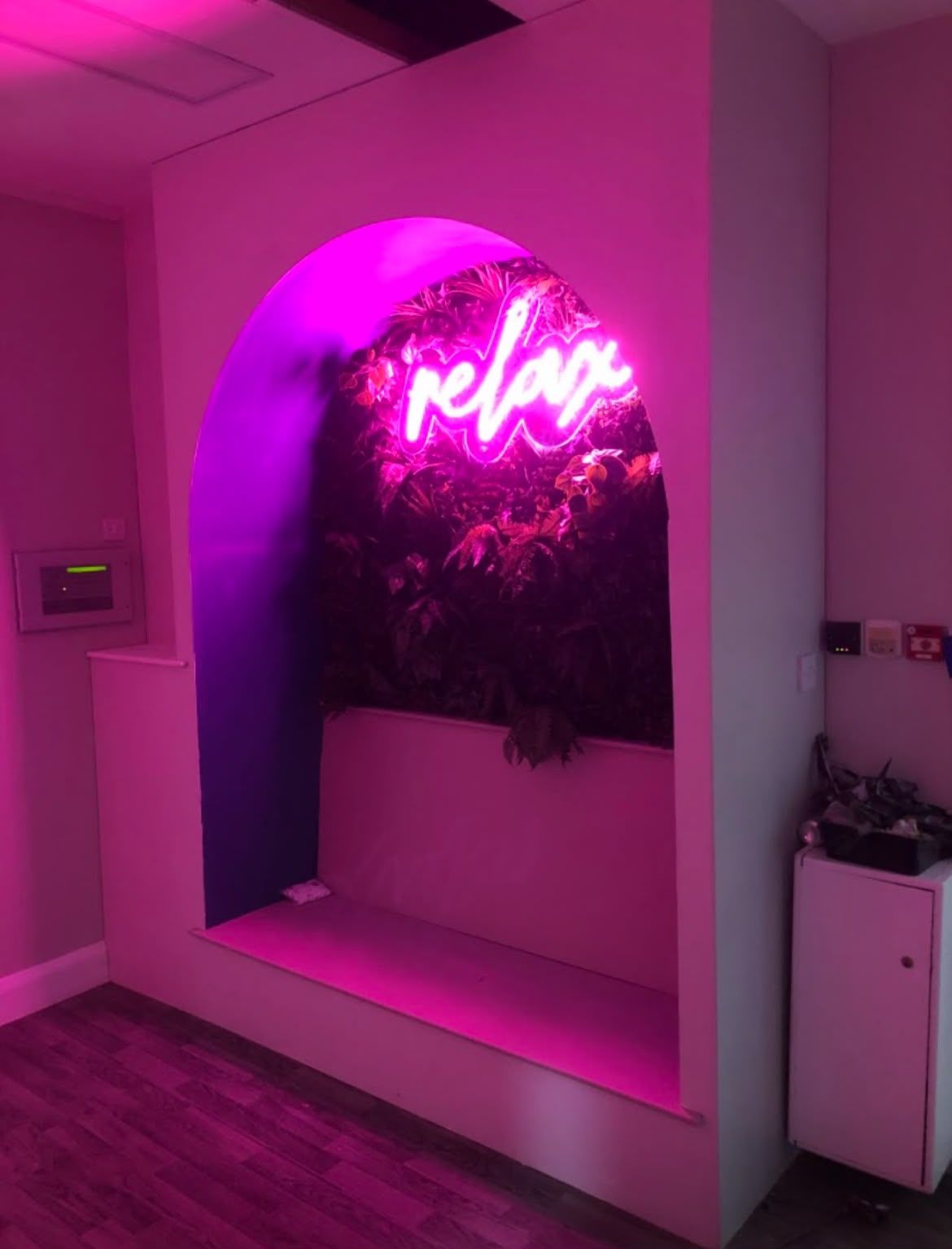Commercial feature wall with arch and neon sign